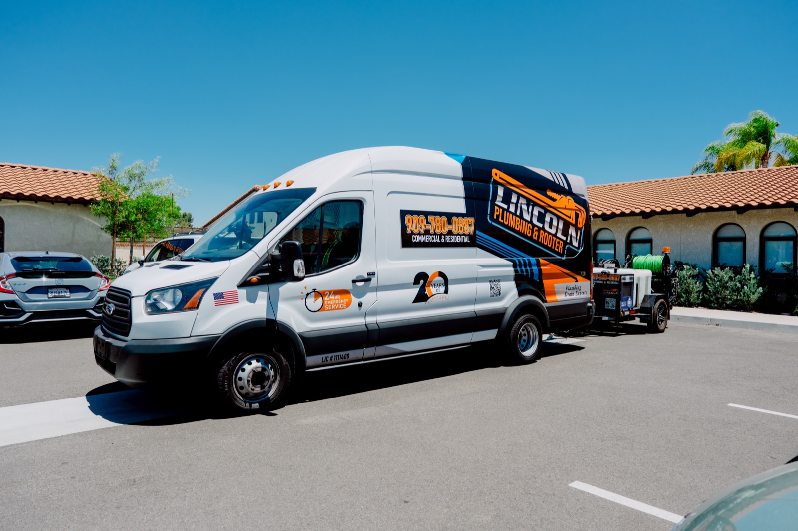 Lincoln Plumbing & Rooter van parked outside a commercial building